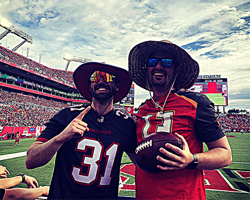 Image of a Bucs fan holding a historic ball
